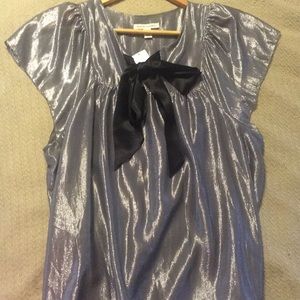 Shimmery silver top with black tie